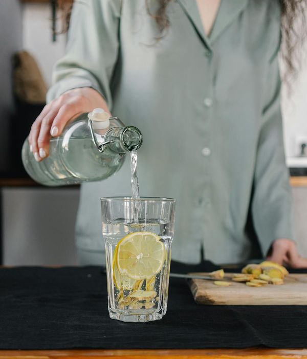 Person smiling and stretching, feeling refreshed after a workout.